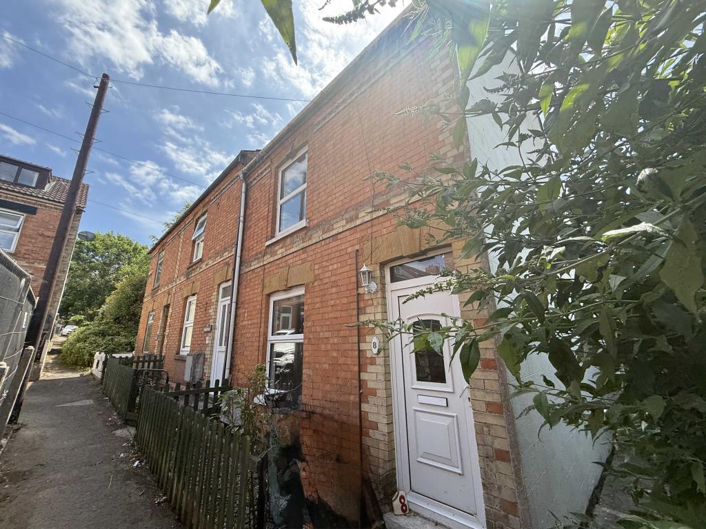 Lot: 128 - END-TERRACE PROPERTY FOR UPDATING - Front of property from different angle